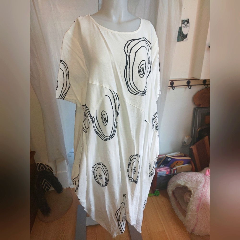 Amanda Collection, Flowy White Dress, with Black Swirl Designs.